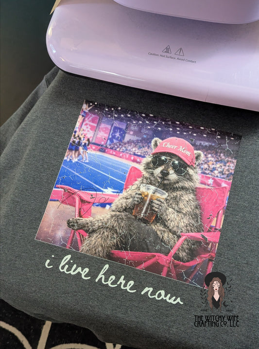 I LIVE HERE NOW - CHEER MOM RACCOON