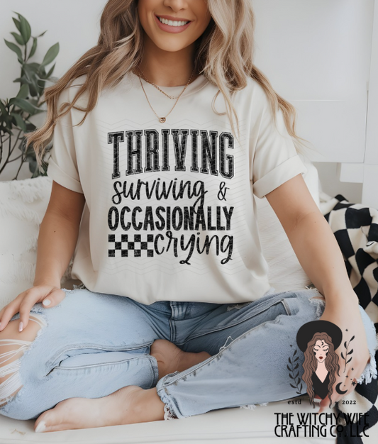 THRIVING SURIVING & OCCASIONALLY CRYING