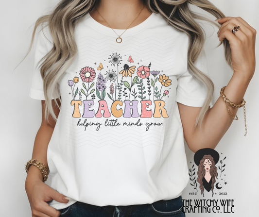 TEACHER HELPING LITTLE MINDS GROW